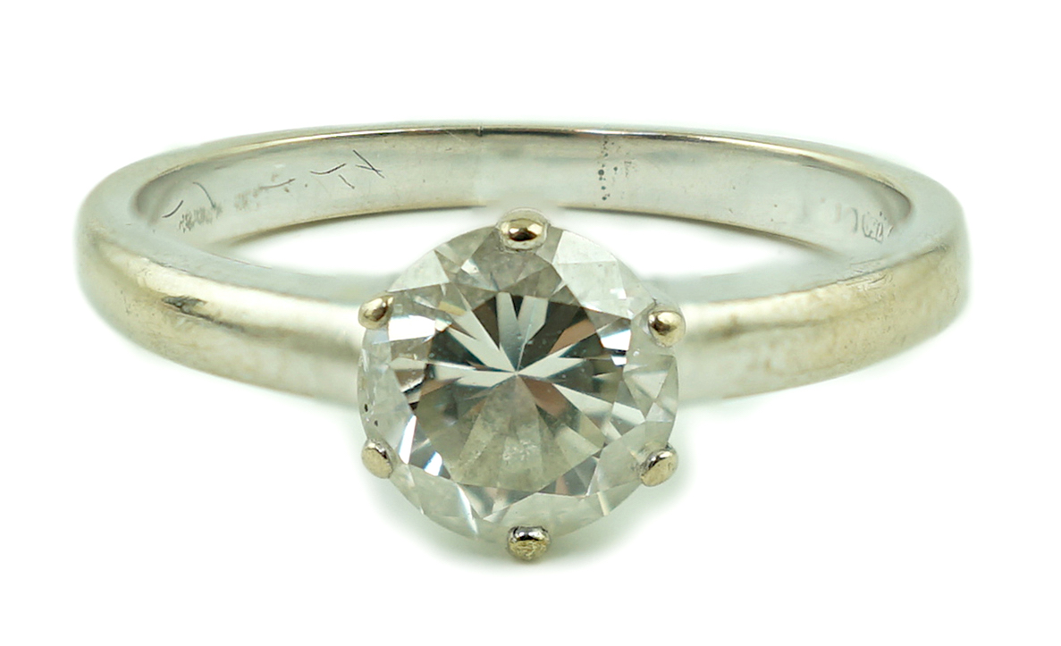 A modern 18ct white gold and solitaire diamond ring